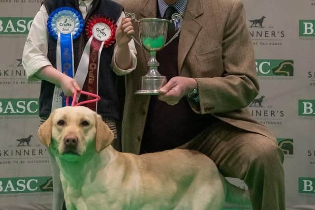 Elodie, pictured with Drift, is presented with her trophy by Ian Grindy, a member of the BASC Council. Image: Nigel Kirby Photography