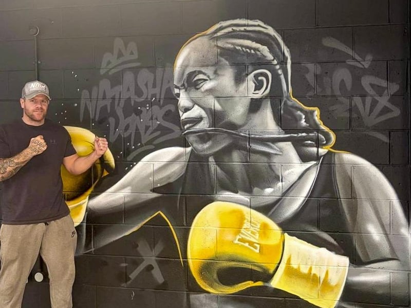Callum alongside more of the site's artwork.