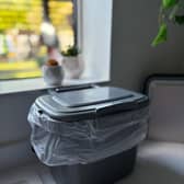 Indoor food waste caddy shown with a liner in place — perfect for collecting kitchen scraps cleanly and conveniently before transferring to the outdoor bin.