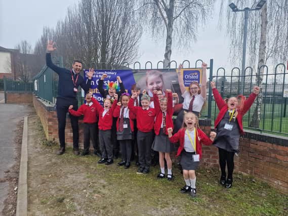 Headteacher Mr Clay and pupil celebrate being outstanding
