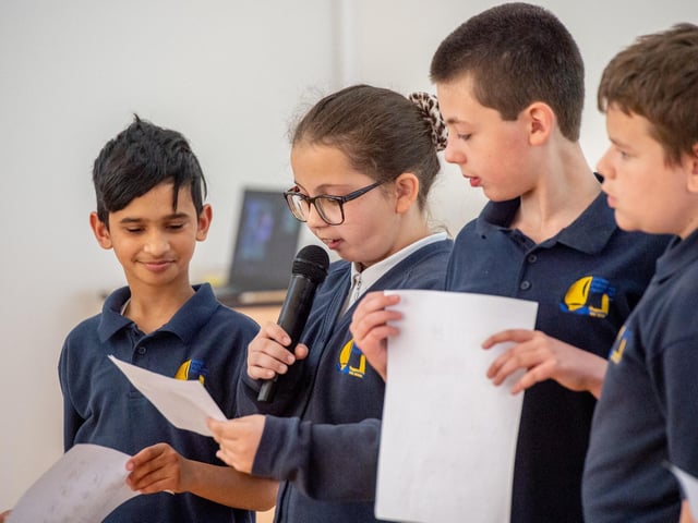 Children form Bubble bees Class read a peom and welcome the visitors