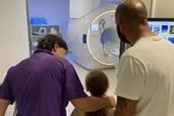Phoebe, Sandy and Chris looking at the MRI scanner, before Radiographer Helen conducted the scan.