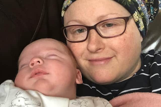 Charlotte with baby Charlie while undergoing cancer treatment.