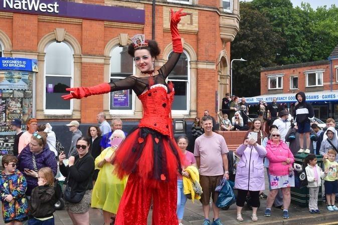 Pose for the camera - a colourful character in the parade.