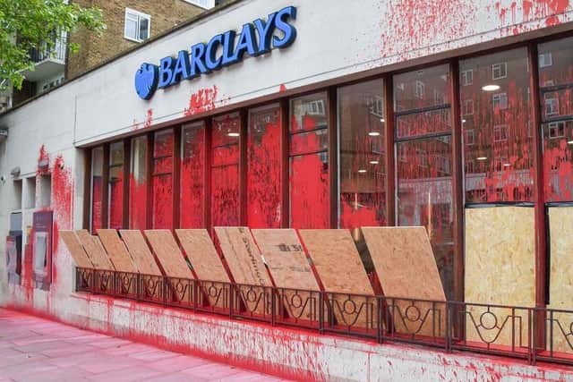Barclays has been targeted by protesters because of its alleged financial support for companies that supply weapons to Israel. Here, one of its London branches has been sprayed with red paint.