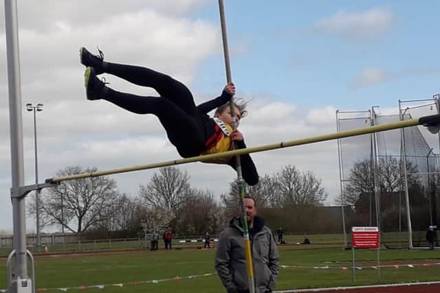 Julia Paluch doing the pole vault.