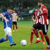 Andrew Wright (left) in action for Matlock Town against Sheffield United.