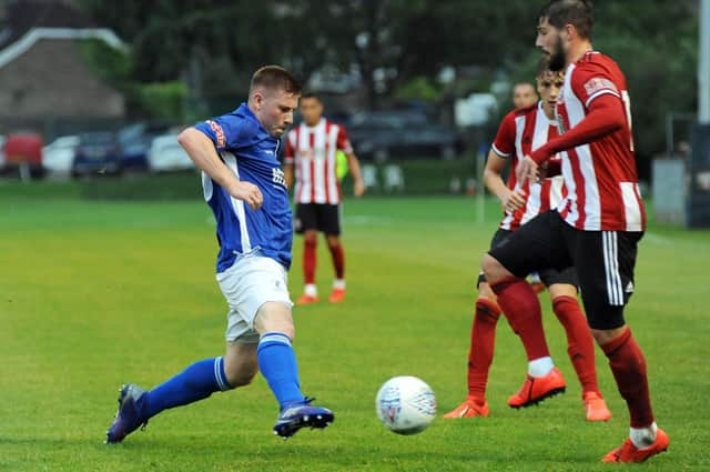 Andrew Wright (left) in action for Matlock Town against Sheffield United.