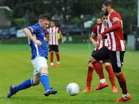 Andrew Wright (left) in action for Matlock Town against Sheffield United.