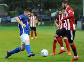Andrew Wright (left) in action for Matlock Town against Sheffield United.