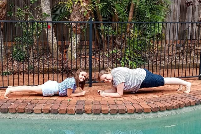 Participants doing planks on their holiday to support the fundraiser for Breast Cancer Now.