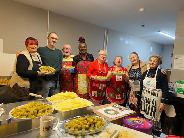 Bamidele Akomolafe, fourth from left) with her team in the kitchen.
