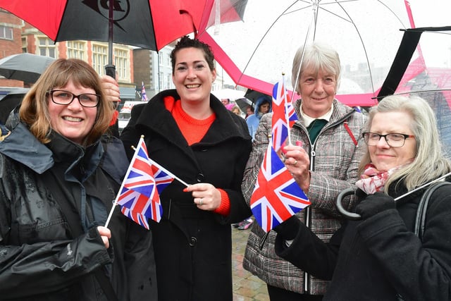 Braving the rain at the Jubilee Party in the Market Place, are, from left, Susan Richards, Emma Scott, Rosie Taylor, and Dee Mason.