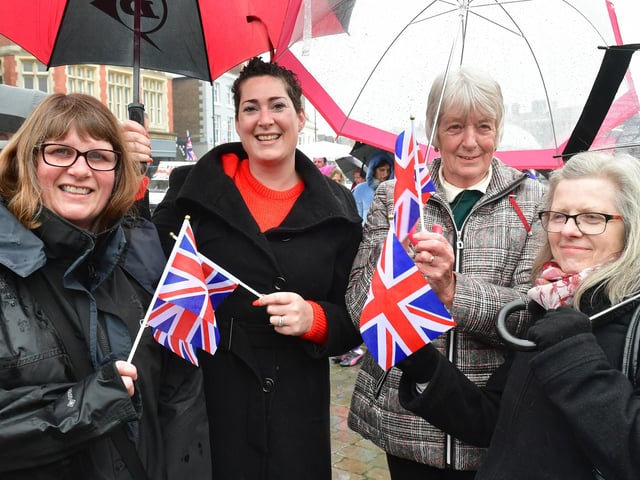 Braving the rain at the Jubilee Party in the Market Place, are, from left, Susan Richards, Emma Scott, Rosie Taylor, and Dee Mason.