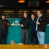 Jack, Kieran and Joe Byrd from Luda (centre) receiving the award from the Hull Minster Beer Festival team.