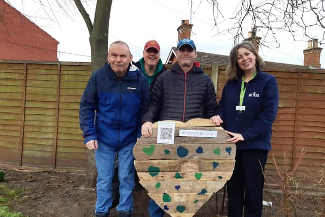 Library manager Kay Turnbull with some of the Old Station Group members and the wooden heart