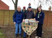 Library manager Kay Turnbull with some of the Old Station Group members and the wooden heart