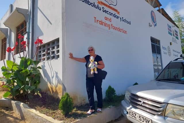Sally Searle outside Bombolulu Secondary School , Kenya.