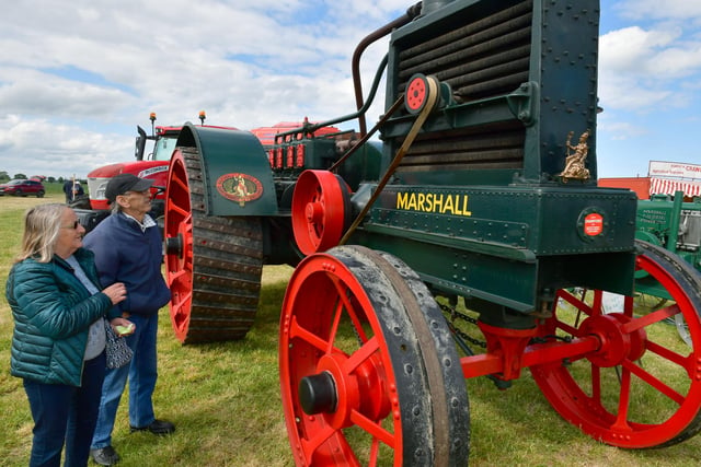 Barbara and John Kingham looking at a 1910 Marshall Colonial Oil Tractor.