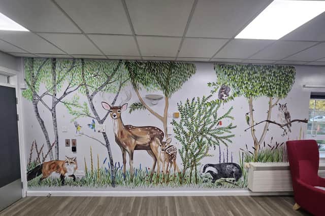 Beach scene painting at Gloucester Ward.