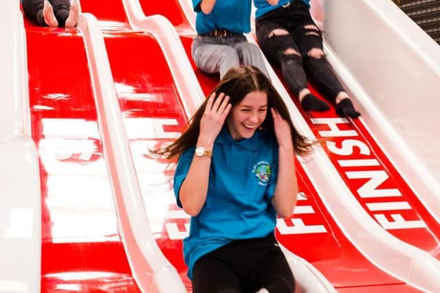 Staff at Play World Gainsborough try out the new slide as it welcomes back customers