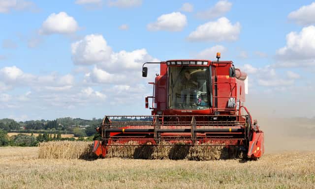 Stock. A combine harvester works in a wheat field, near Mountnessing, in Essex.  PRESS ASSOCIATION Photo. Picture date:  Friday August 15, 2008.   Photo credit should read: Ian Nicholson/PA