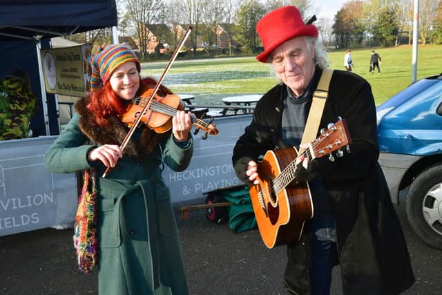 Penny Stevens and Less Woods (Pennyless) entertaining the shoppers at Heckington Pavilion market.