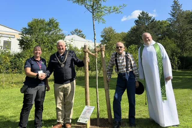 Brian Chapman (second right) after unveiling the Skegness Twinning Association plaque by the memort at the State Garden Show
