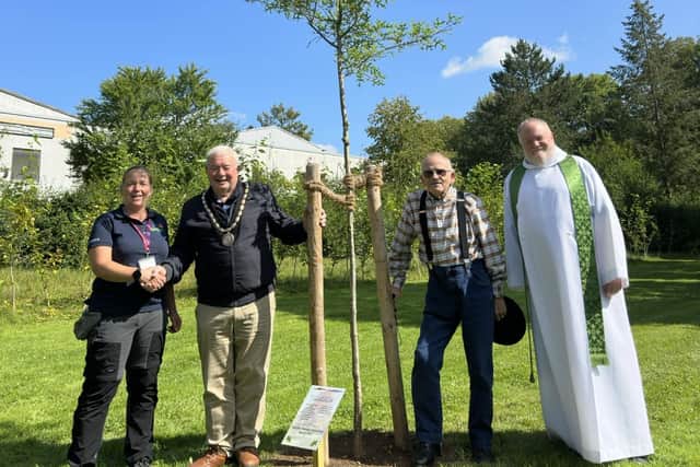 Brian Chapman (second right) after unveiling the Skegness Twinning Association plaque by the memort  at the State Garden Show