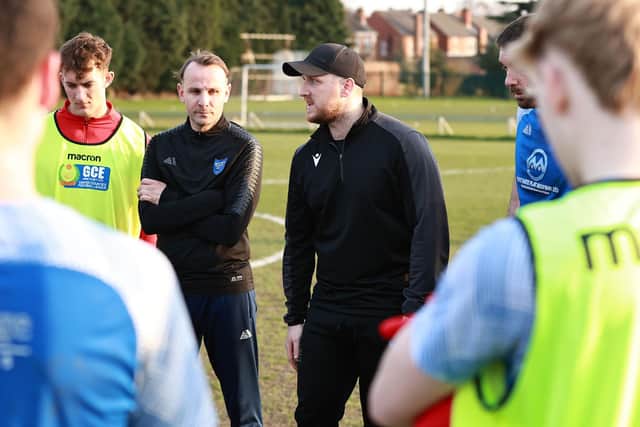 Manager Chris Funnell having his trademark team debrief on the pitch at full time - (Steve W Davies)