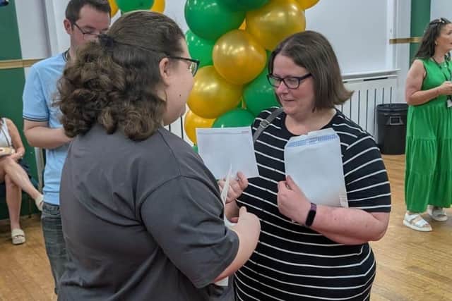 Ella Blythyn (left) opening her results.