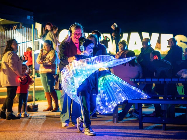 Illuminated wings created a mesmerising display at the silent disco.