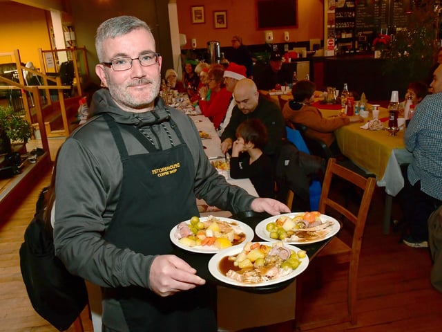 Volunteer, Martin McKechnie serving meals.