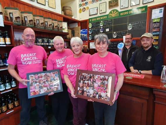 From left - Darren Leavens, Sharon Jackson, her mum Rita Jones, Liz Ward from the Mill Tearoom and Steve Adams and Callum Kopp from 8 Sail Brewery with images from their Wear It Pink Day. Photo: Andy Hubbert