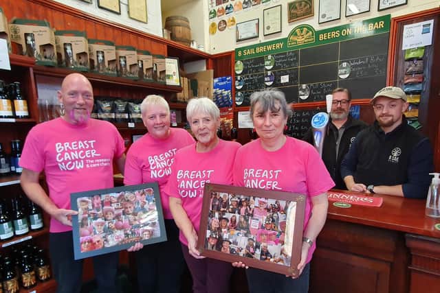 From left - Darren Leavens, Sharon Jackson, her mum Rita Jones, Liz Ward from the Mill Tearoom and Steve Adams and Callum Kopp from 8 Sail Brewery with images from their Wear It Pink Day. Photo: Andy Hubbert