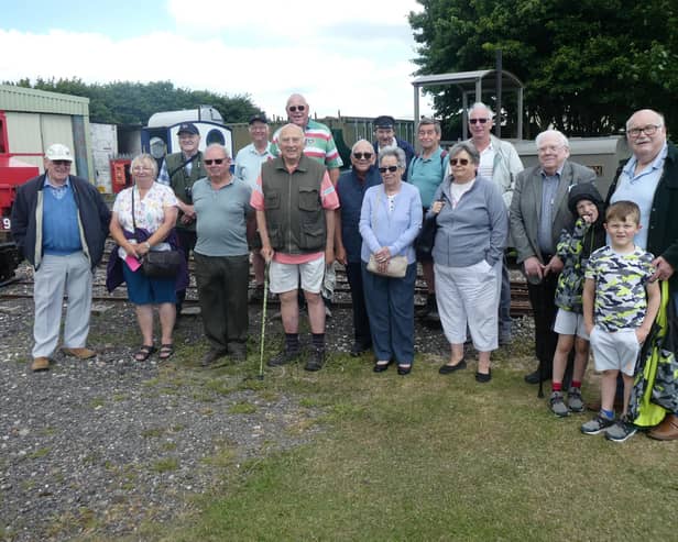 Skegness Probus Club in the LCLR's yard with Peter Balderstone, against a background of locomotives 'Sark', "Paul' and 'Wilton'.