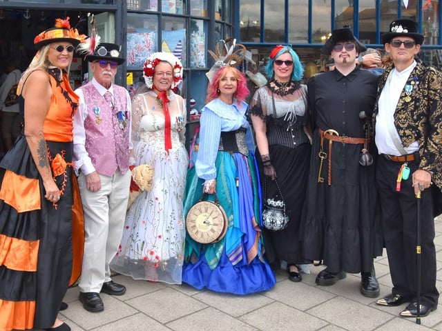 The fancy-dress theme of the event is followed to the letter by this group of striking strutters.