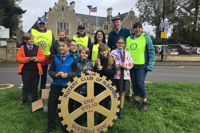 William Alvey pupils at Sleaford Rotarians break off from their crocus bulb planting at Gregson Green. Photo: William Alvey School