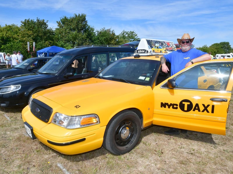 Tom Willis, with his 2011 New York Taxi.