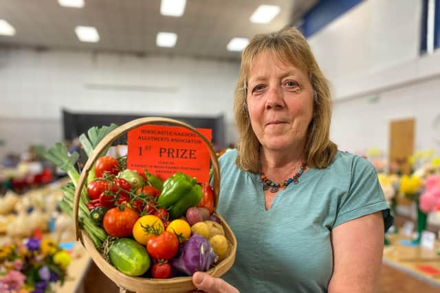 Kathy Breton with her basket which won 1st Prize for Mixed Garden Vegetables.