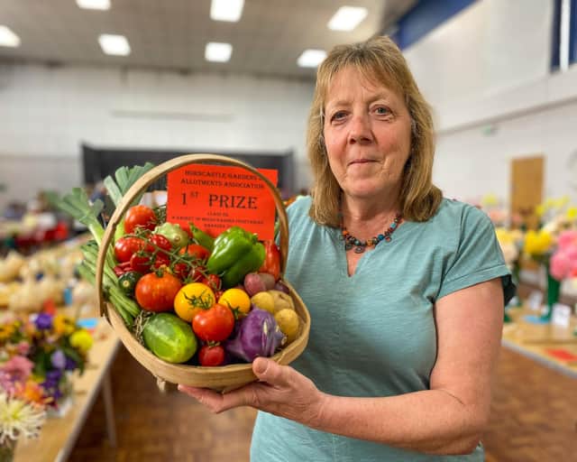 Kathy Breton with her basket which won 1st Prize for Mixed Garden Vegetables.
