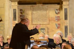Choir with conductor, Rowland Lee