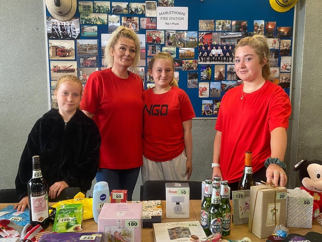 Emmie Ward, Melanie McNaughton, Taylor McNaughton and Laci Ward running the tombola at the Fire Station Open Day.