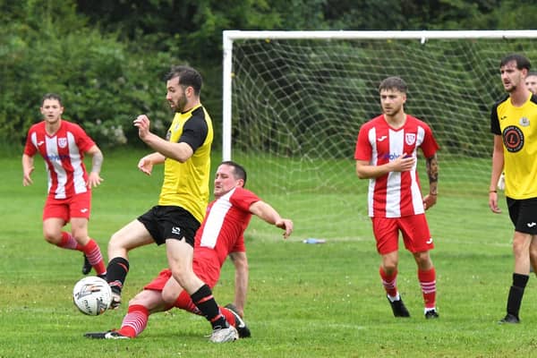 Action from Horncastle's (in red and white) win at Theddo on Saturday. Photo: Rob Savage.