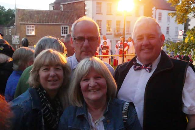 Smiling at the lighting of the beacon, from left: Ray and Chris Baker with Adrian and Alison Gorst.