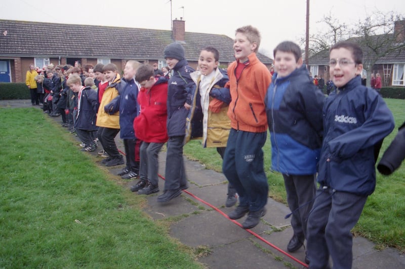 Children from Hawthorn Tree School, Boston, breaking a Red Nose Day record by leaping from east to west over the Meridian Line.