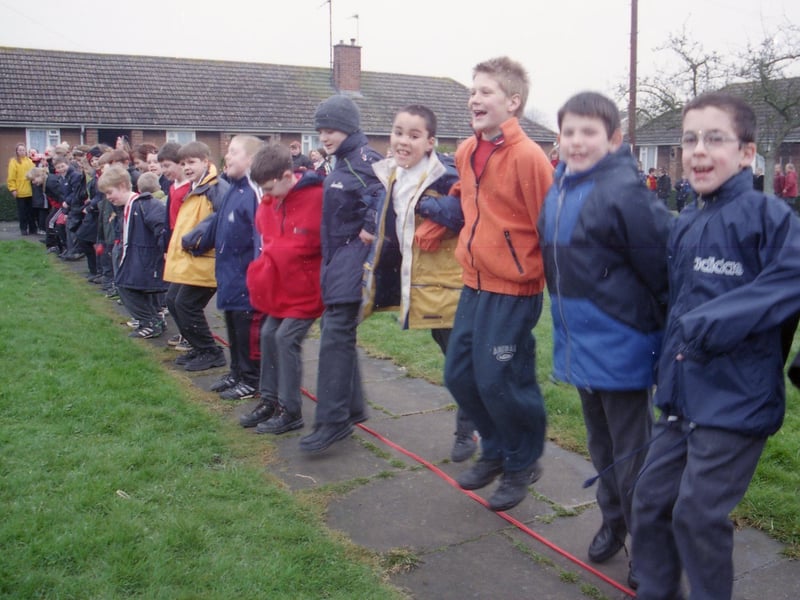 Children from Hawthorn Tree School, Boston, breaking a Red Nose Day record by leaping from east to west over the Meridian Line.