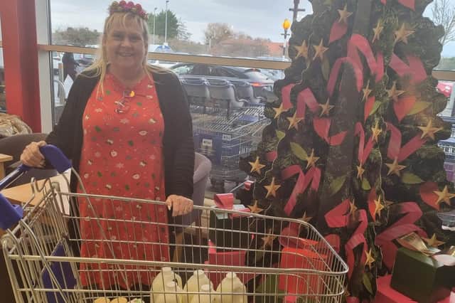 Jeanette Morley, Community Services Manager at Tesco in Skegness with the donation for the Storehouse event.