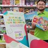Asda Boston's, Taylor Pearce, with the special collection trolley.