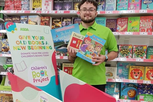 Asda Boston's, Taylor Pearce, with the special collection trolley.